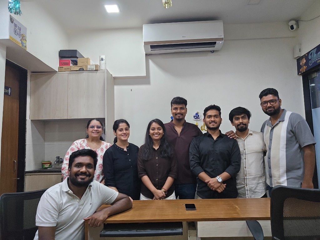 Let's Manage team at the office